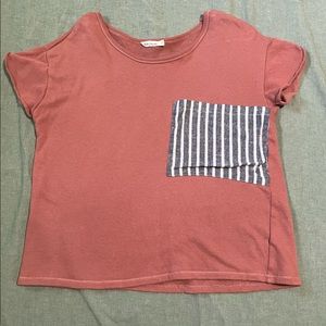 Pink womens shirt with oversized white and blue stripped pocket